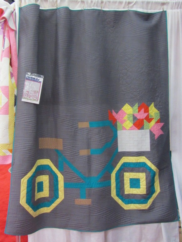 Love the graphic look of this bicycle quilt.  Sorry I didn't write down the company who featured it in their booth.
